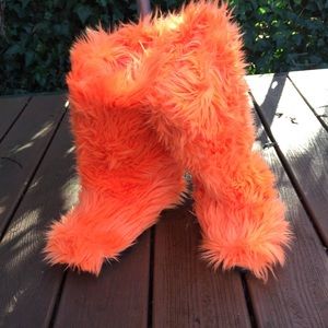 Orange fuzzy boot slippers